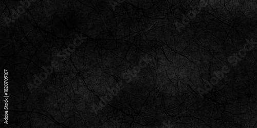 Black dark grunge stone texture with rough, natural crack wall surface background. uneven pattern resembling weathered black rock or charcoal. Panorama black canvas slate texture. marble background.