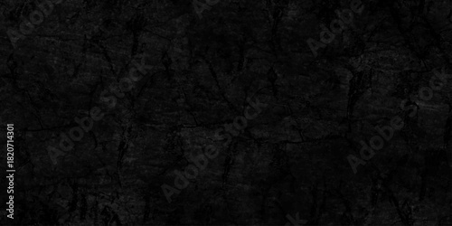 Black dark grunge stone texture with rough, natural wall surface background. uneven pattern resembling weathered black rock or charcoal. Panorama black canvas slate texture. blackboard background.