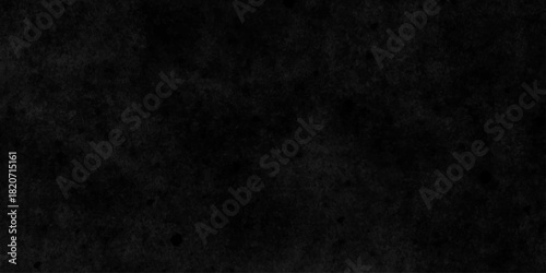 Black dark grunge stone texture with rough, natural wall surface background. uneven pattern resembling weathered black rock or charcoal. Panorama black canvas slate texture. blackboard background.