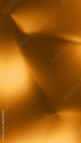Closeup of a shimmering golden surface with soft folds and abstract light reflections