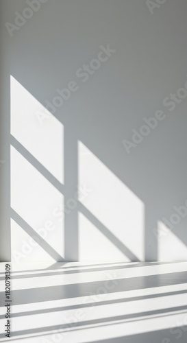 Abstract white wall background featuring strong geometric shadows cast by window frames, creating a moody, architectural minimalist aesthetic ,backdrop ,mockup ,shadow