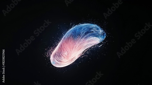 An abstract, oval-shaped object composed of flowing, colorful strands, with water droplets splashing around it against a dark background. The strands transition