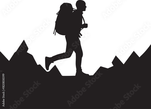 Silhouette of a hiker with a large backpack traversing rocky mountain terrain