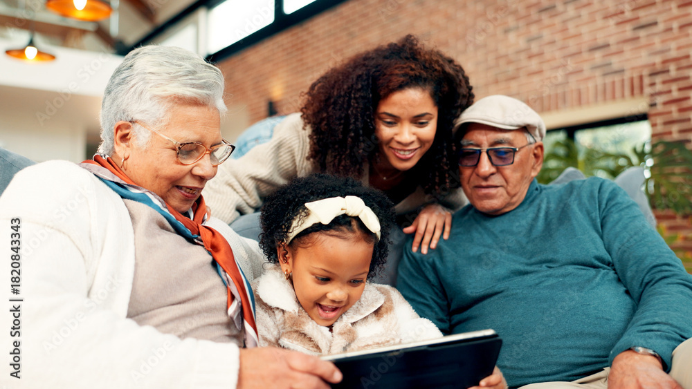 Obraz premium Grandparents, girl and mother on sofa with tablet, relax and bonding with movie in living room. Senior people, child and mom with application, streaming or film subscription on couch at family house