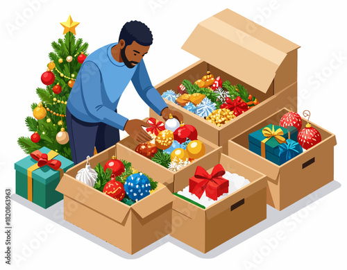 Man packing Christmas ornaments and decorations into cardboard boxes near a decorated Christmas tree, preparing for storage.