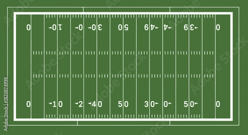 Overhead view of an American football field with yard lines and numbers.