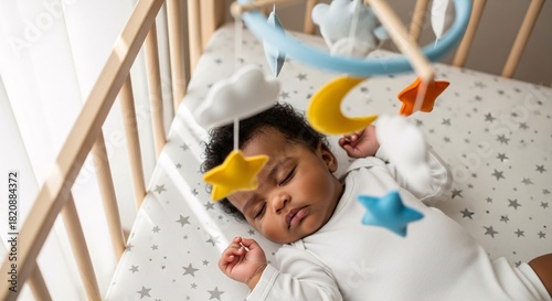 Serene Slumber: A Precious African American Baby Peaceful Sleep in Crib Under Gentle Mobile Newborn Innocence Restful Infant Bliss Childhood Dreams Sweet Dreams 180chars