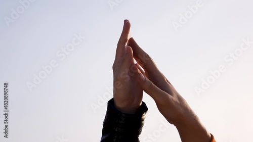 Hands touch fingertips in quiet greeting showing connection and cooperation between two people gesture of unity and friendship closeup of hand touch and fingertip contact conveying trust and bond