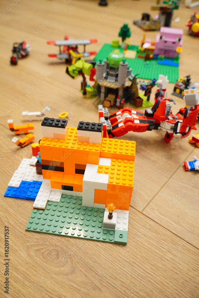 Obraz premium Creative LEGO Fox Build with Other Colorful LEGO Creations on Wooden Floor
