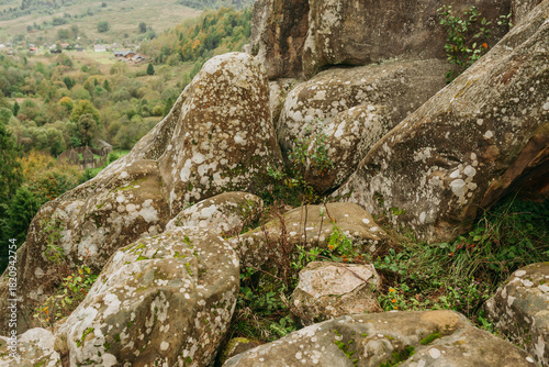 Rocky cliffs and green mountain landscape in the Ukrainian Carpathians — natural sandstone formations and forest view