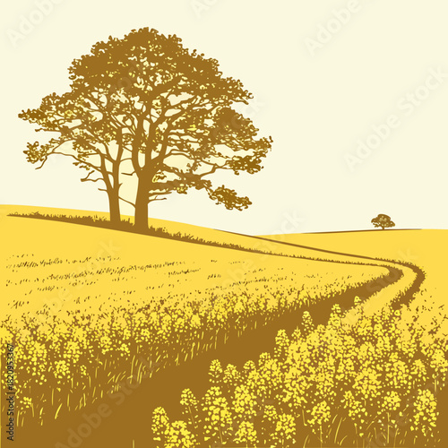 Golden field of blooming rapeseed flowers with a winding path and large oak tree under a pale sky
