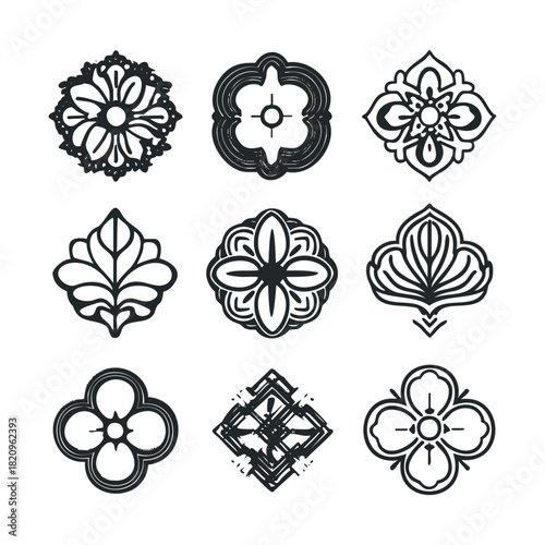 Set of nine black and white flower and leaf-based motifs.