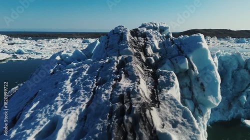 Wallpaper Mural Majestic icebergs breaking off a melting glacier and gliding through Iceland’s Jökulsárlón lagoon, creating a breathtaking Arctic landscape. Torontodigital.ca