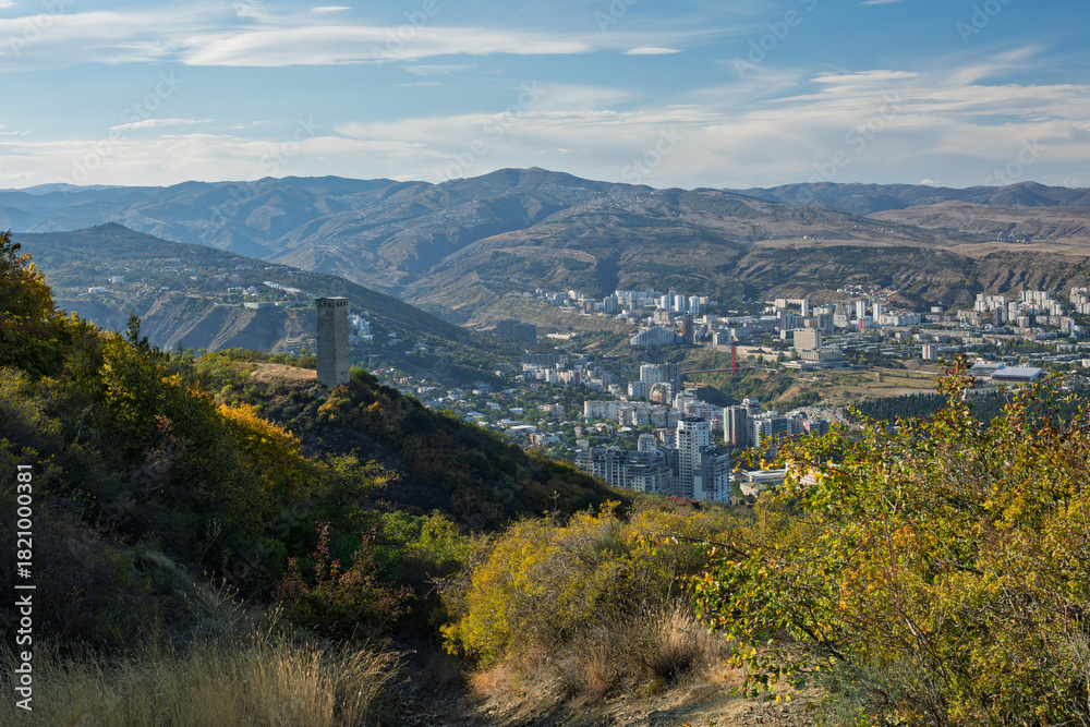 Obraz premium Scenic View Of Stone Tower On Hill Overlooking Tbilisi Cityscape
