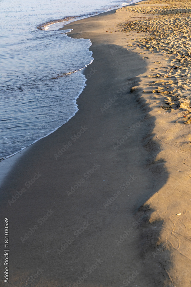 Fototapeta premium Morning surf on the Tyrrhenian Sea, Italy, Viareggio.