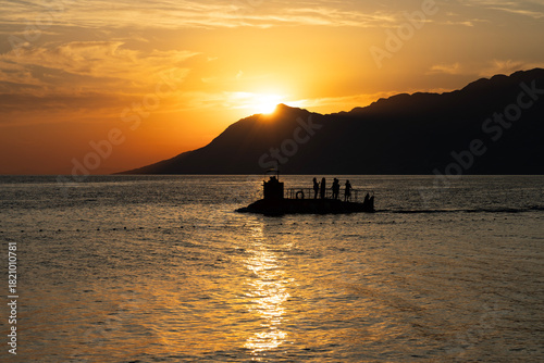 Fototapeta Naklejka Na Ścianę i Meble -  Tourist submarine at sunset in the Adriatic Sea. Croatia