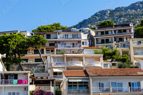 Fototapeta Naklejka Na Ścianę i Meble -  A mountainside hotel in Makarska, Croatia. View from below.