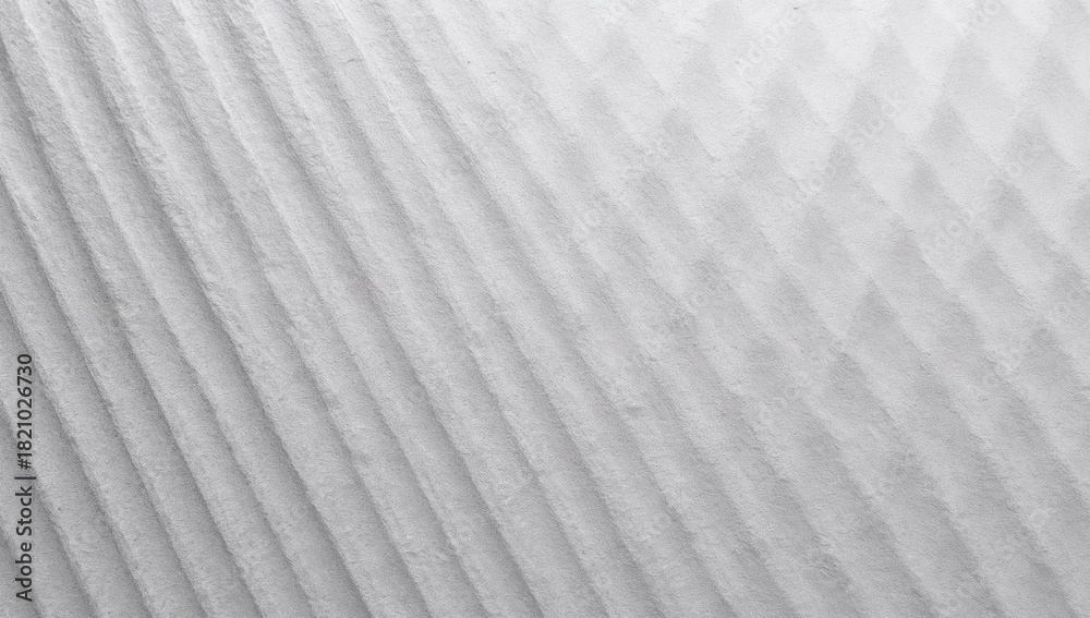Obraz premium Capturing textured ribbed surface under angled studio light, with diagonal ridges and soft shadows