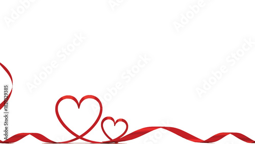 Delicate red ribbon forming hearts on a white background for romantic occasions