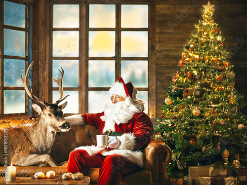 Santa Claus Relaxing with his Companion Reindeer at Home