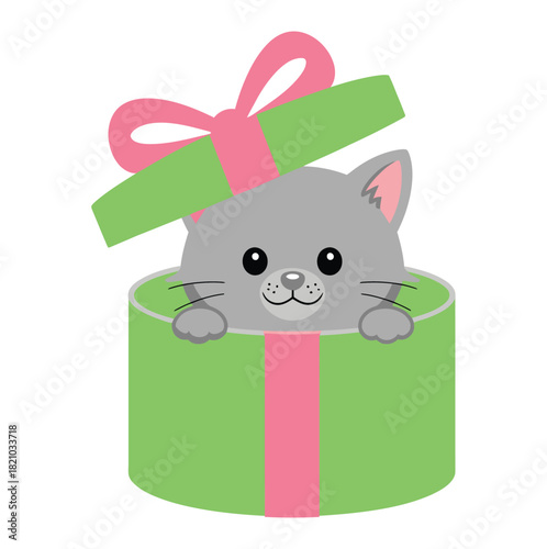 A cute grey kitten peeks out from inside a bright green gift box tied with a pink ribbon and bow, appearing as a delightful surprise.