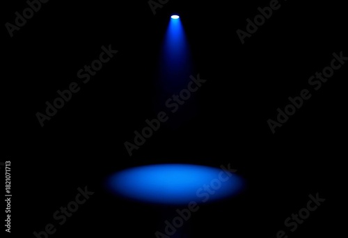 Intense blue spotlight illuminating dark background,  color,  ray