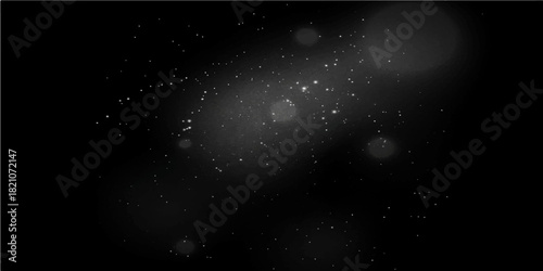 Abstract black and white space background with bright star particles in a dark night sky universe resembling a nebula or galaxy
