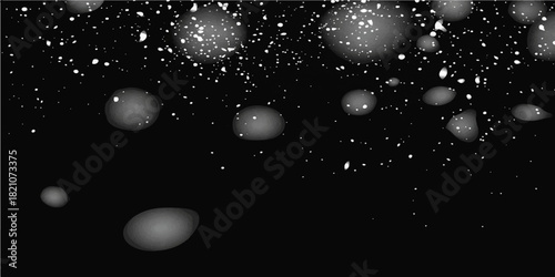 Water drops on a black background illustrate cold winter night design with falling blue particles and a star-like light glow