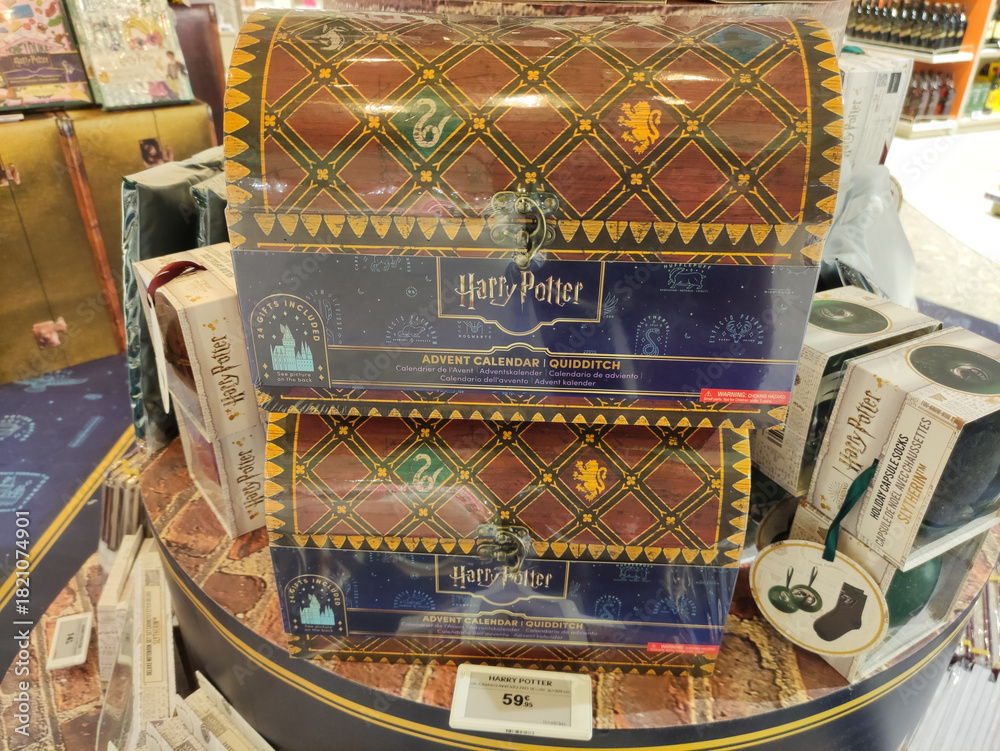 Fototapeta premium Rome, Italy - November 20, 2025: Harry Potter Advent Calendar Quidditch themed gift box displayed on a retail table, showcasing vibrant colors and intricate designs for fans of the series