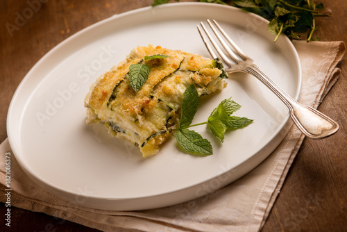 Zucchini flan with cheese and mint leaves