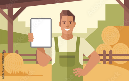 Cheerful farmer in overalls holding a blank tablet at a farm with hay bales