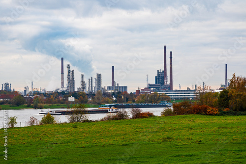Atmospheric skies over industrial buildings on the Rhine in Germany.