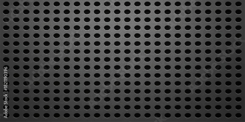Dark gray perforated metal sheet with circular holes background texture