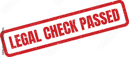 Red rubber stamp with textured surface displaying the important words LEGAL CHECK PASSED confirming successful review