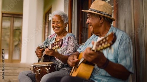 Senior couple playing guitars and singing on porch