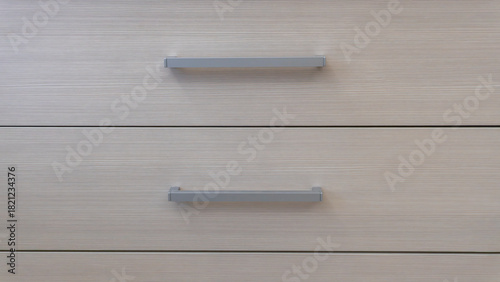 close-up of the texture and part of the cabinet with handles