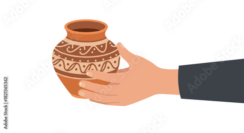 Hand holding decorative clay pot with intricate patterns on white background