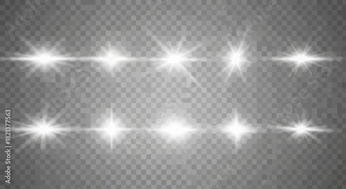 Collection of bright white lens flares on a transparent background