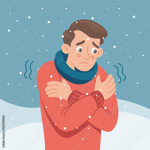 Man shivering in a cold winter snowy landscape. Man is freezing from the cold