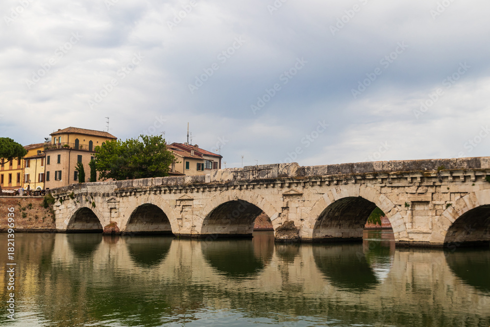 Naklejka premium The Bridge of Tiberius over the Marecchia river in Rimini, Italy