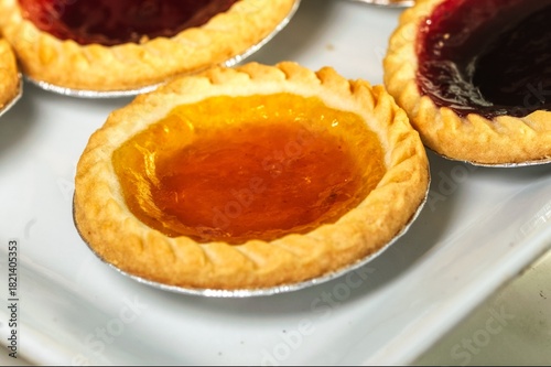close up photo of some jam tarts