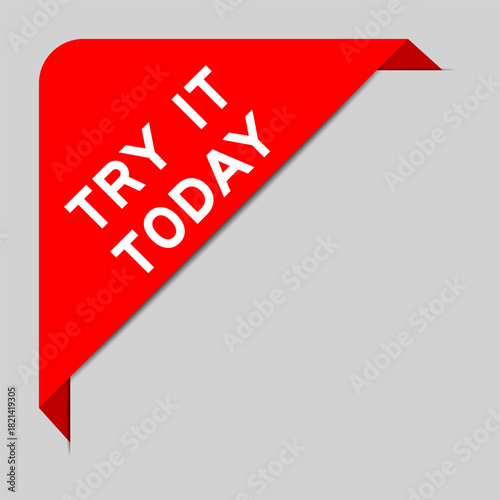 Red color of corner label banner with word try it today on gray background