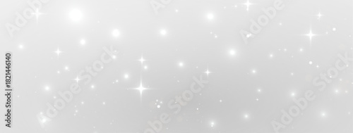 Magical festive texture with bright golden glow, shimmering stardust particles, soft bokeh illumination and elegant transparent holiday background