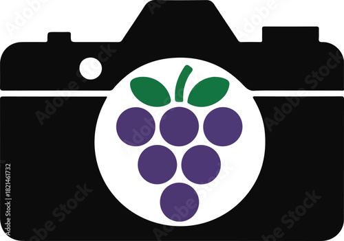 Creative photography concept with grapes obscuring a camera lens