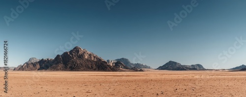 Wide desert landscape with rocky mountains under a clear blue sky, showing warm tones and open space in a dry natural environment, idea for travel themes, nature visuals, and background scenes