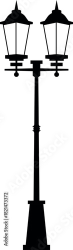 A tall black pole with two lamps on top