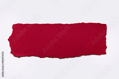 Torn red paper on white background