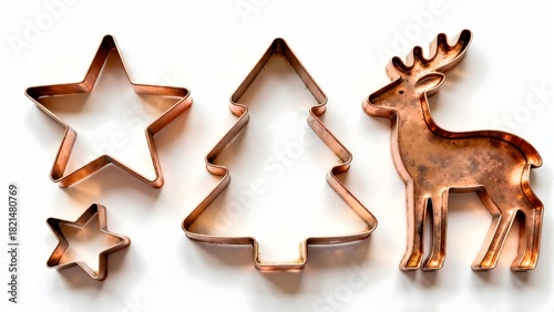 Vintage copper Christmas cookie cutters isolated on white background. Essential baking tools for holiday season, traditional cooking concept.