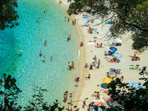Overhead view of people swimming and sunbathing at Rovinia Beach