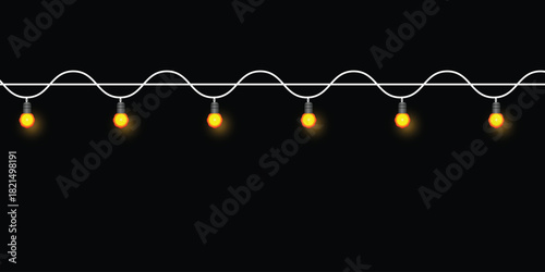 Decorative string lights with warm glowing bulbs on white wavy wire